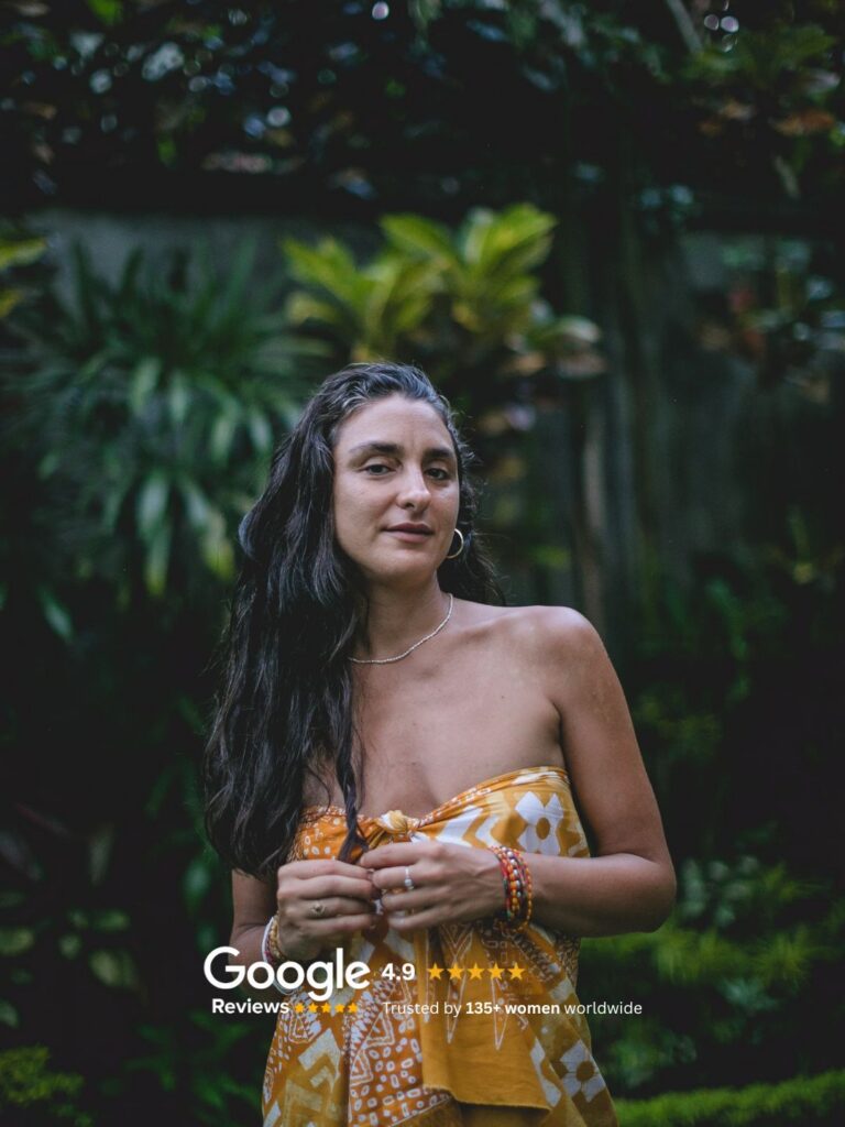 Woman sitting alone in peaceful tropical nature at luxury private retreat in Ubud Bali