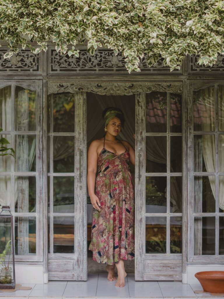 Radiant glowing woman awakening with eyes closed at luxury wellness retreat Ubud Bali 11:11 Bali Retreats