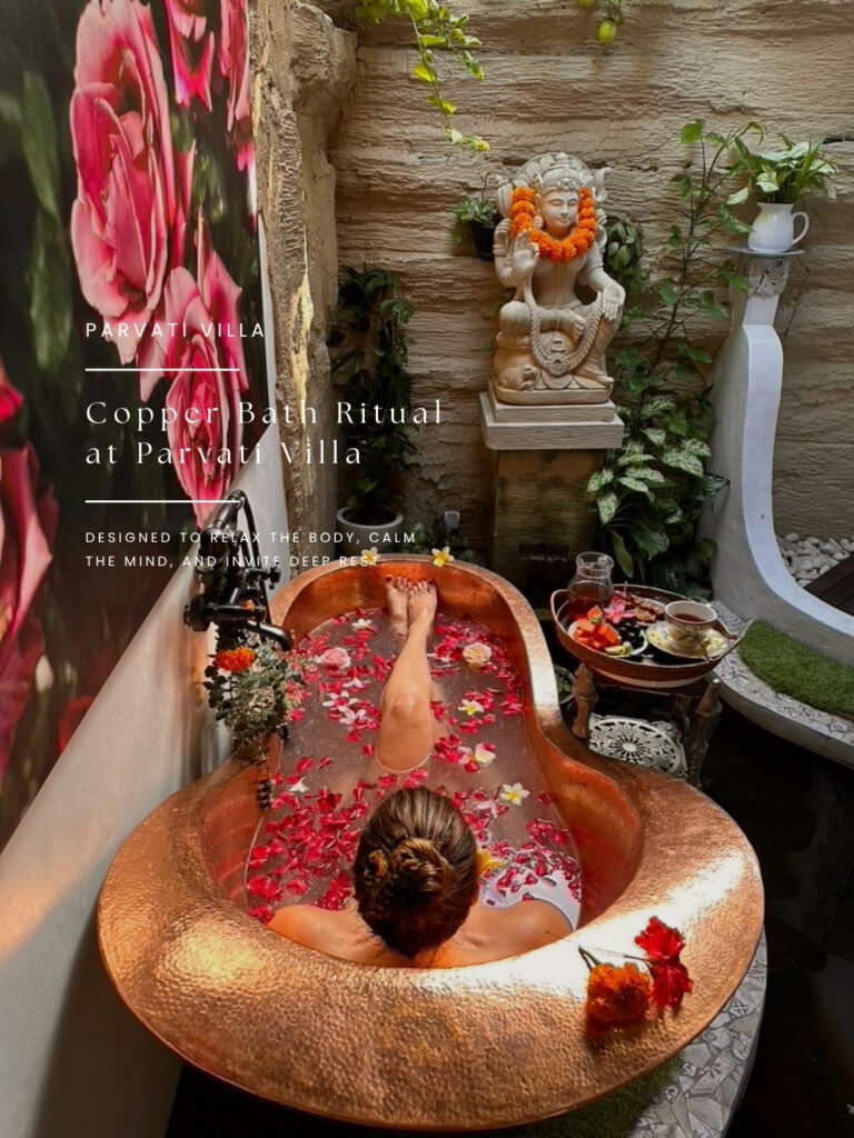 Candlelit rose and frangipani flower bath ritual at private luxury villa in Ubud Bali